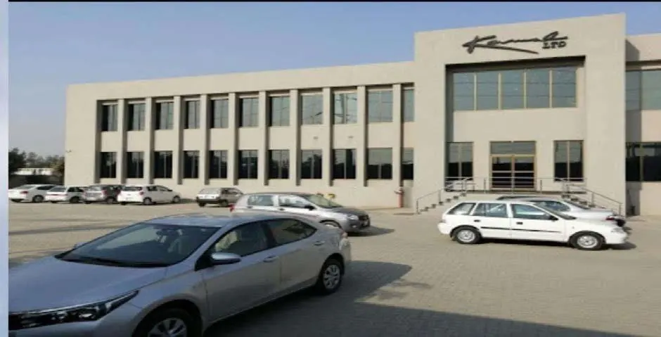 Two-storey industrial office block with a car park in front