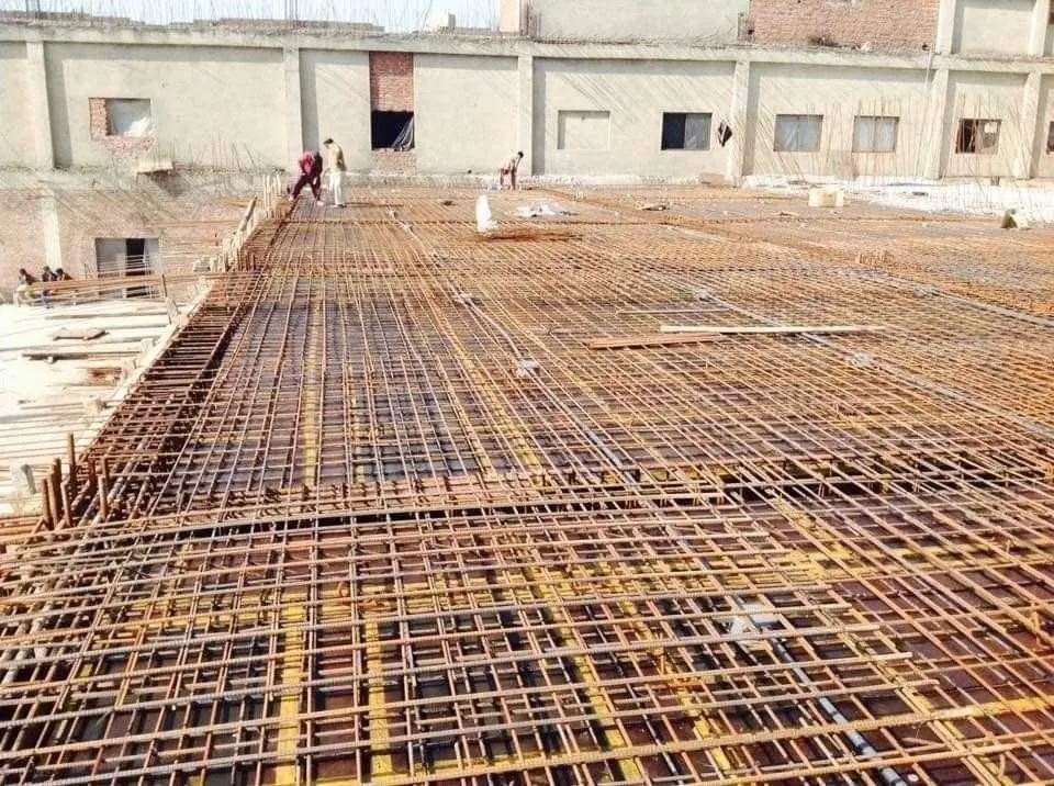 Steel reinforcement mesh laid for a large concrete floor slab on a factory site